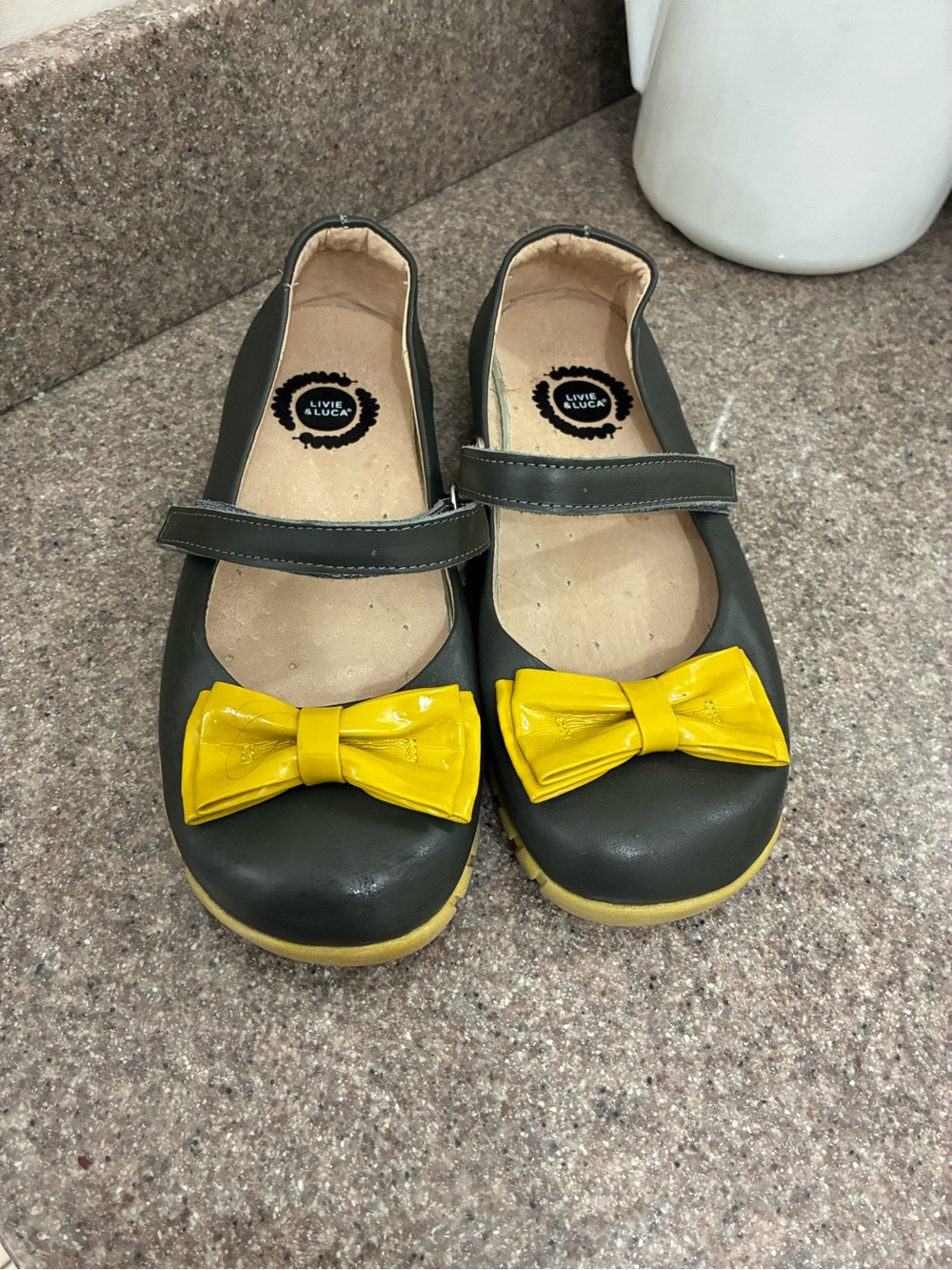 Livie & Luca Black Mary Jane Shoes with Yellow Bows